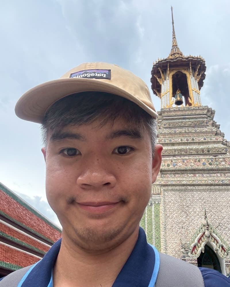 Folk, the guide who built TourSquad, at the Grand Palace in Bangkok